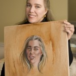 ingrid_posing-with-portrait-1 me, holding my portrait, as part of my Indianapolis Monthly story about having my portrait done (by the talented Constance Scopelitis)
